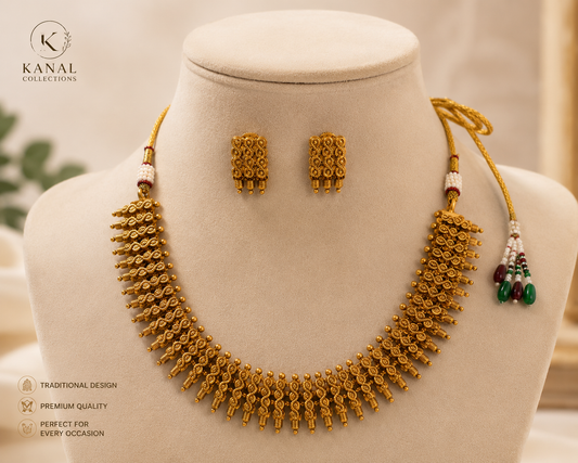 Kanal Collections antique gold traditional Indian style necklace and matching stud earrings set on a display bust with price tag