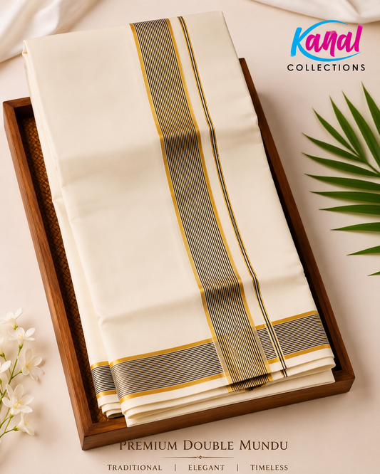White saree with gold and green stripes in a wooden tray on a light background, featuring 'Kanal Collections' branding.